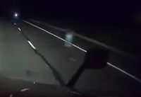 A Truck driver's dashcam catches a ghost on Highway 87, sparking a frenzy in paranormal interest; cover