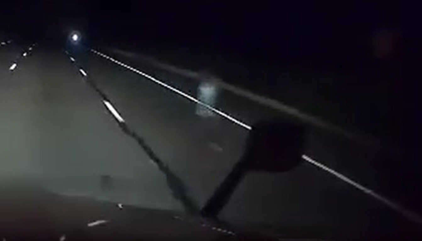 A Truck driver's dashcam catches a ghost on Highway 87, sparking a frenzy in paranormal interest; cover